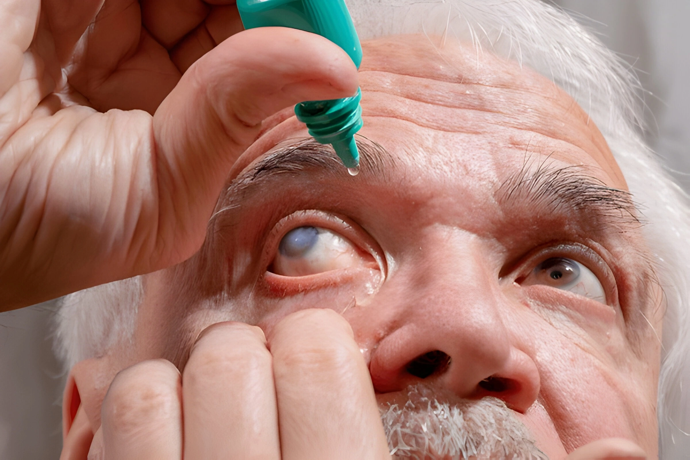 Patient taking eye drops